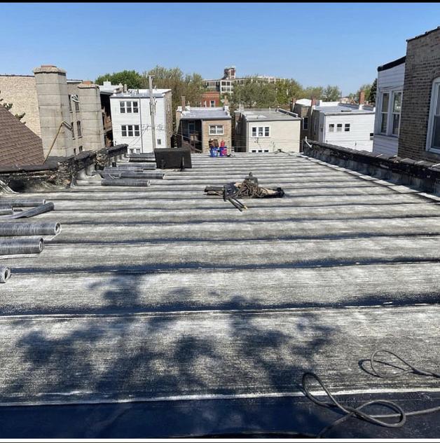 Laying down new roof membrane 